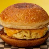 Egg Sando · Scrambled egg and American cheese. Add sausage or bacon for additional charge.