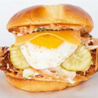 The Early Bird · Buttered bun, jumbo tender, slaw, pickles, fried egg, American cheese, comeback sauce.
