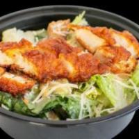 Blazing Caesar · Romaine lettuce, seasoned croutons, chicken tender, dressing and Parmesan cheese.