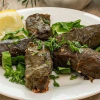Vegetarian Dolma · Tender grape leaves stuffed with rice, parsley, lemon juice, & olive oil.