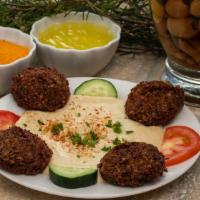 Hummus With Falafel · Hummus served with 4 pieces of falafel.