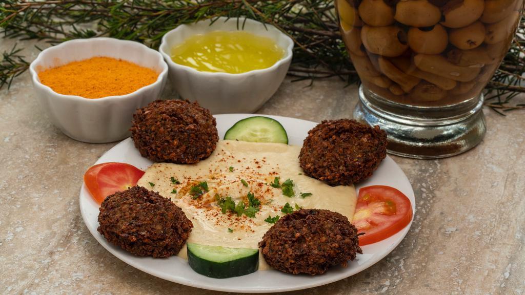 Hummus With Falafel · Hummus served with 4 pieces of falafel.