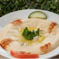 Hummus · Garbanzo dip with tahini lemon juice, and garlic.
