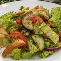 Fatoush Salad - Large · Romaine lettuce, tomato, cucumber, onion, sumac, parsley, and fried pita topped with fresh d...