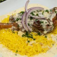 Mansaf · Lamb shank topped with a creamy yogurt and garlic sauce served on a bed of basmati rice. Inc...