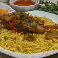 Lamb Kabsa · Basmati rice cooked with traditional kabsa spices, with a juicy lamb shank served on a bed o...