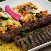 Mixed Grill · Chicken Kabob, Kafta Kabob, and Gyro slices served on a bed of basmati rice. Includes hummus...