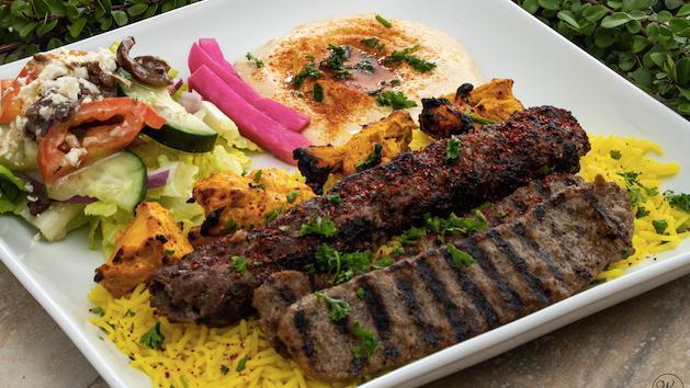 Mixed Grill · Chicken Kabob, Kafta Kabob, and Gyro slices served on a bed of basmati rice. Includes hummus and choice of salad.
