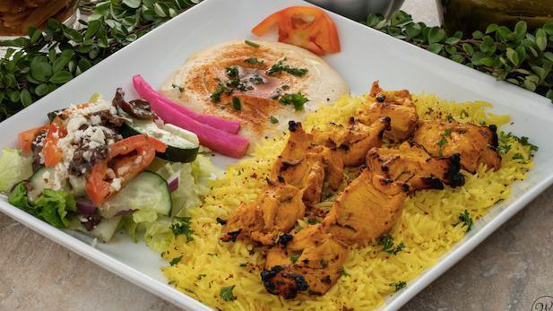 Chicken Kabob Plate · 2 skewers of grilled chicken breast served on a bed of basmati rice. Includes hummus and choice of salad.