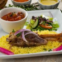 Kuzi · Sautéed lamb shank served with your choice of okra (bamya) or potato stew served on a bed of...