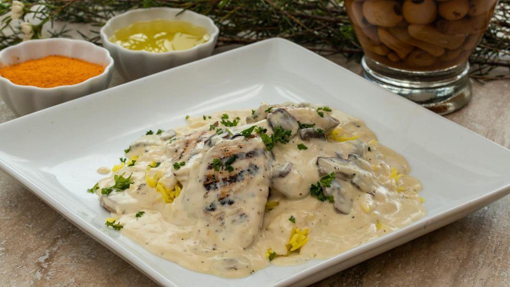Chicken Marsala · Grilled chicken breast with mushrooms, garlic, and a creamy white sauce served on a bed of basmati rice. Includes hummus and choice of salad.