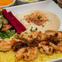 Shrimp Scampi · Sautéed shrimp cooked with onion, garlic, and tomato served on a bed of basmati rice. Includ...