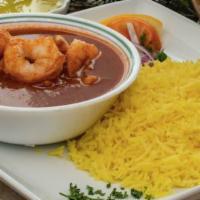 Shrimp Curry · Shrimp curry based in a tomato sauce served on a bed of basmati rice. Includes hummus and ch...