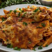 Bechamel Pasta · Layers of pasta, ground beef, cheese, and béchamel sauce.