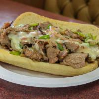 Philly Cheese Steak · Beef Grilled with Peppers Onions and topped with Swiss Cheese