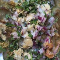 Samosa Chaat · Fried potato pastry. served with generous amounts of chickpea gravy spread over it with onio...