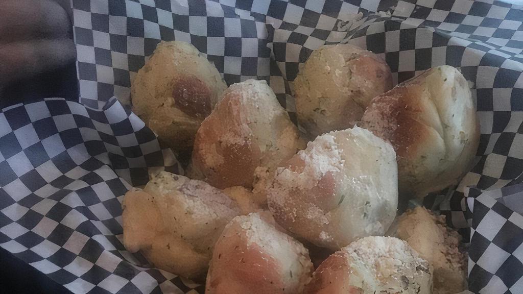 Basket Of Our Famous Garlic Knots · Seasoned Knots baked and served with our house-made tomato sauce.