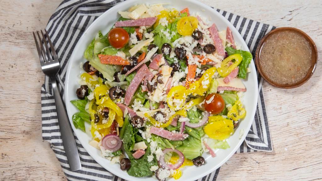 Antipasto Salad (Dressing On The Side) · Romaine lettuce, tomatoes, black olives, red onions, banana peppers, capocolla, Genoa salami, pepperoni, mozzarella, provolone and Romano cheeses.