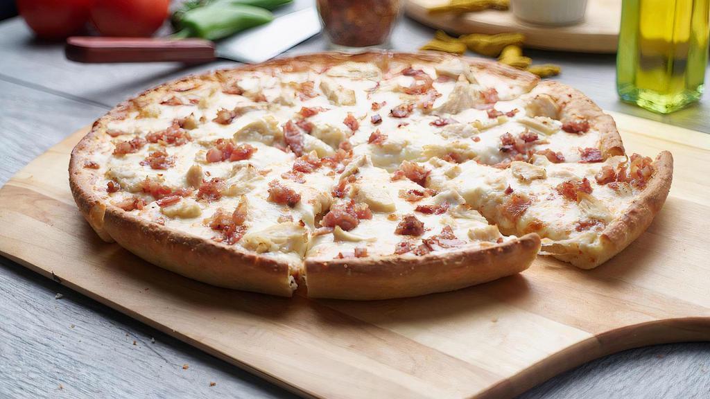 Chicken Bacon Ranch Pizza · This pizza has our signature creamy garlic sauce, fresh diced mozzarella cheese, All-Natural Garlic Chicken Breast,  and crunchy bacon