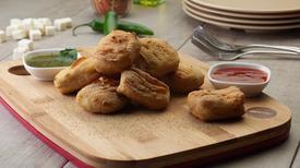 Paneer Pakora (4) · Large squares of marinated paneer breaded and baked to a golden brown. Served with our ...