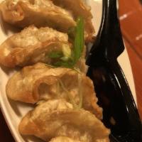 Vegetable Gyoza · Six Japanese pot stickers are a fun favorite! Little fried wrappers are filled with veggies,...