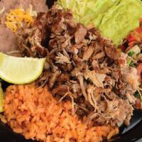 # Carnitas Plate · With two tortillas, rice and beans.