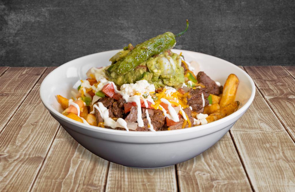 Carne Asada Fries · Seasoned french fries, refried beans, carne asada, pico de gallo topped with cheddar cheese, queso fresco, sour cream, and fresh guacamole.

*Papas frltas, frijoles, came asada, pico de gallo, queso fresco y cheddar, crema, y guacamole fresco.