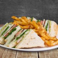 Guac Turkey Sandwich · Sourdough toast, sliced turkey, lettuce, tomato, onion, swiss cheese, bacon, and guacamole s...
