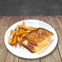 Jr Breakfast Sandwich · White toast, American cheese, a slice of ham, and egg. / Pan tostado, queso americano, jamón...
