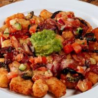 Party Tots · Seasoned tots topped with beer cheese, bacon, roasted jalapeños, salsa fresca and fresh avoc...