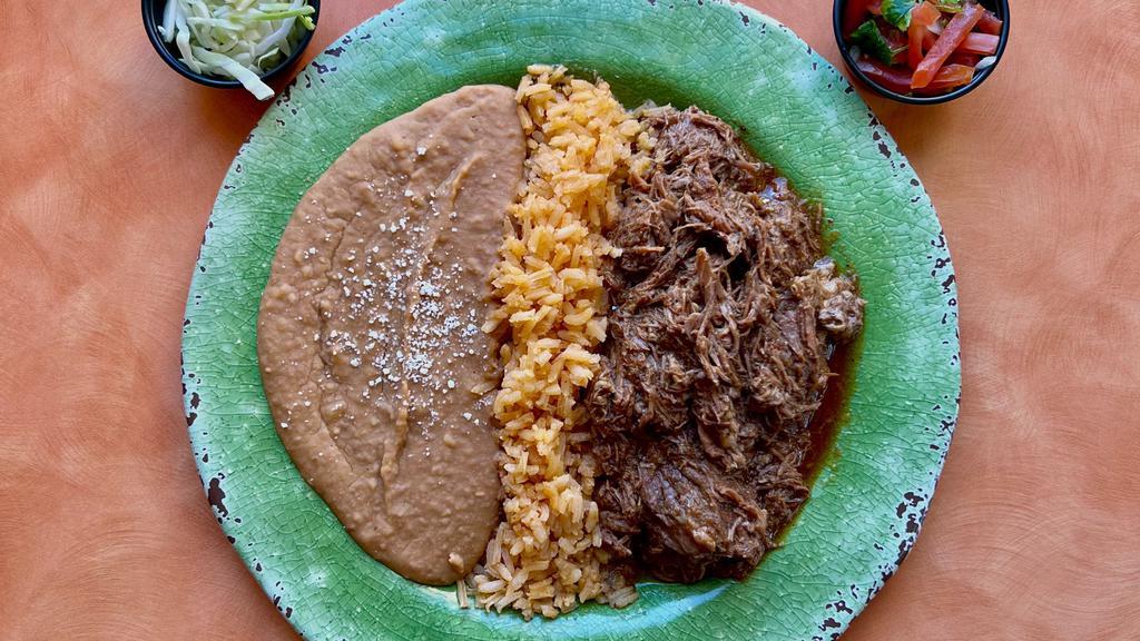 #17 Beef Barbacoa Plate · Beef barbacoa with pico de gallo and cabbage on a plate with rice and beans.