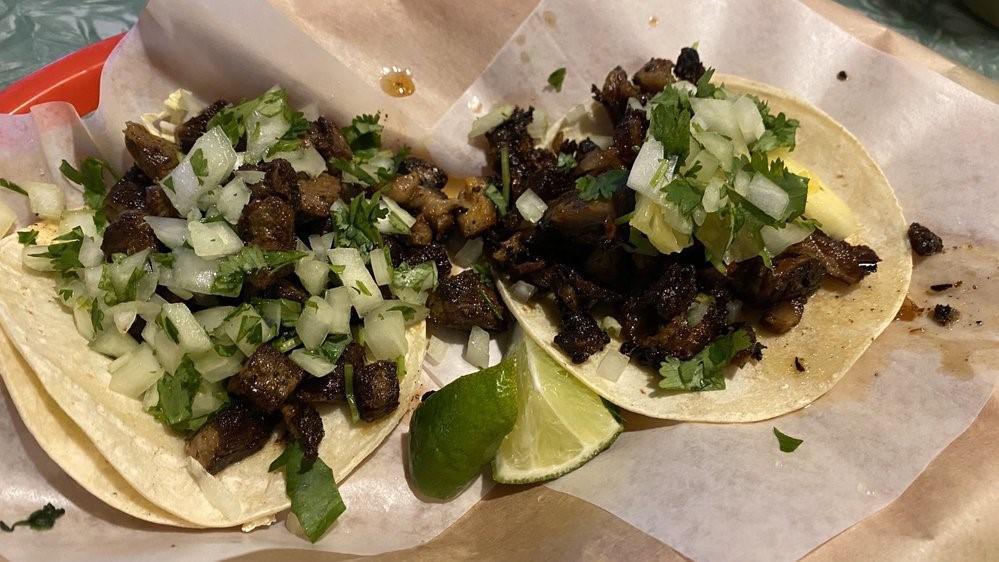 Asada Taco · Tender grilled marinated steak. Diced onion and cilantro. Served on two hot corn tortillas.