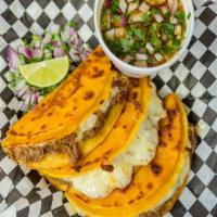 Quesabirria (3 Pc) With Consome · Comes with consome (dipping sauce) grilled corn tortilla, birria, cheese, cilantro and onions