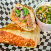 Burrito With Consome · Comes with consome (dipping sauce) 12” flour tortilla, birria, cheese, rice, beans, onions, ...