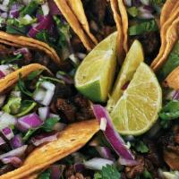 Taco(Each) · Folded tortilla with a variety of fillings such as meat or beans.