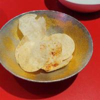 Papadum · Wafer thin lentil crackers flavored with cumin.