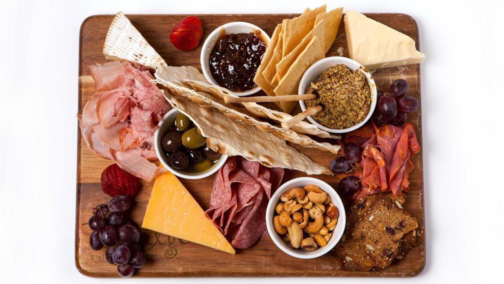 Indulgent Cheese & Charcuterie Board · Three artisan meats and seasonal cheeses accompanied with an accoutrement of fun things.