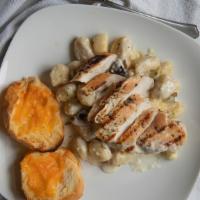 White Truffle Chicken Gnocchi · Grilled chicken, potato gnocchi and crimini mushrooms in a garlic truffle cream reduction, s...