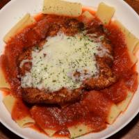 Chicken Parmigiana · Chicken parmigiana served with pasta topped with marinara and mozzarella, served with crosti...