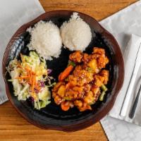 Sweet & Sour Chicken · Deep-fried chicken tender in sweet and sour sauce. Served with rice and salad.