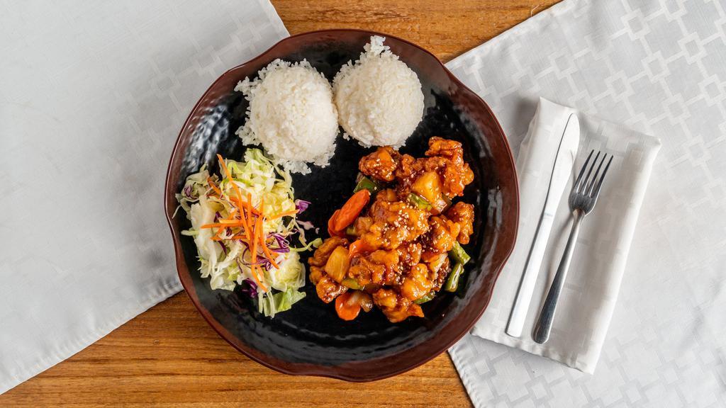 Sweet & Sour Chicken · Deep-fried chicken tender in sweet and sour sauce. Served with rice and salad.