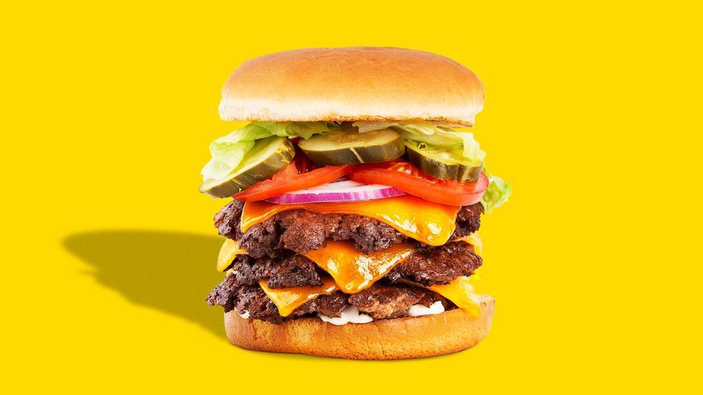 Triple Cheeseburger · Three beef patties, 3 slices of American cheese, tomato, lettuce, onion, pickles, mayo.