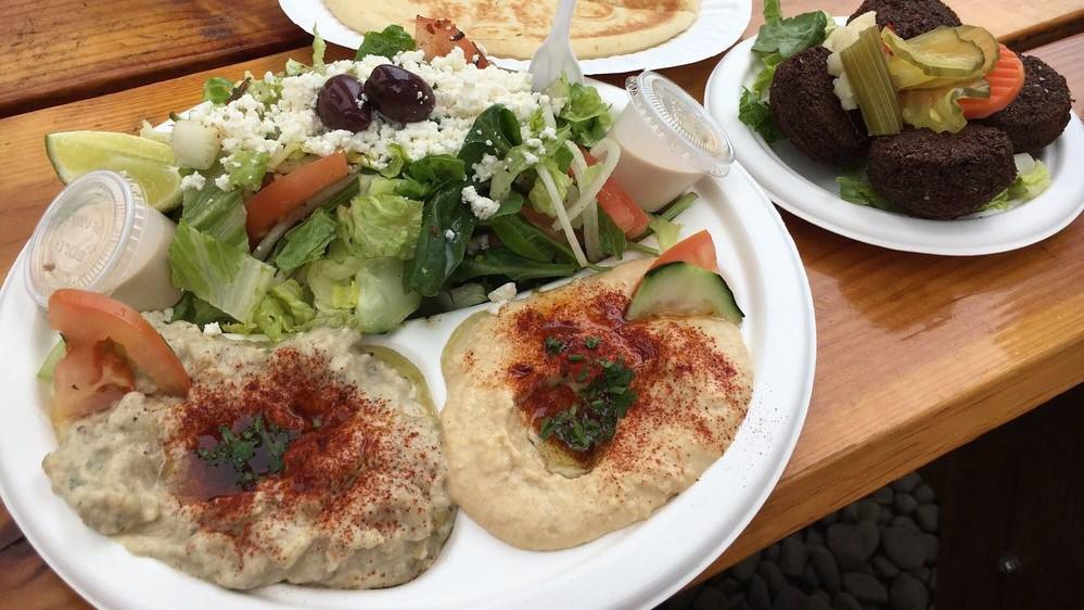 Vegetarian Mezza · Hummus, baba ganoush, falafel, dolmas, Greek salad.