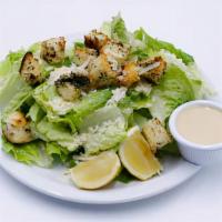 Caesar Salad · Crisp Romaine lettuce, shredded Grana Padano & house made croutons, tossed in our creamy Cae...