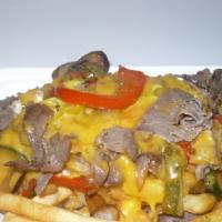Philly Steak Over Fries · Serve with grilled onion,mushroom,green/red pepper and cheddar cheese .