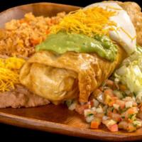 13 Chimichanga Plate · Shredded beef chimichanga with bell peppers, tomatoes, and onions topped with guacamole and ...
