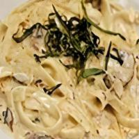 Fettuccini Alfredo · House made alfredo sauce. sauteed mushrooms and garlic, topped with parmesan