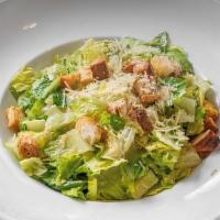 Classic Caesar Salad · Chopped Romaine hearts, grated parmesan, and house made croutons tossed in Caesar dressing