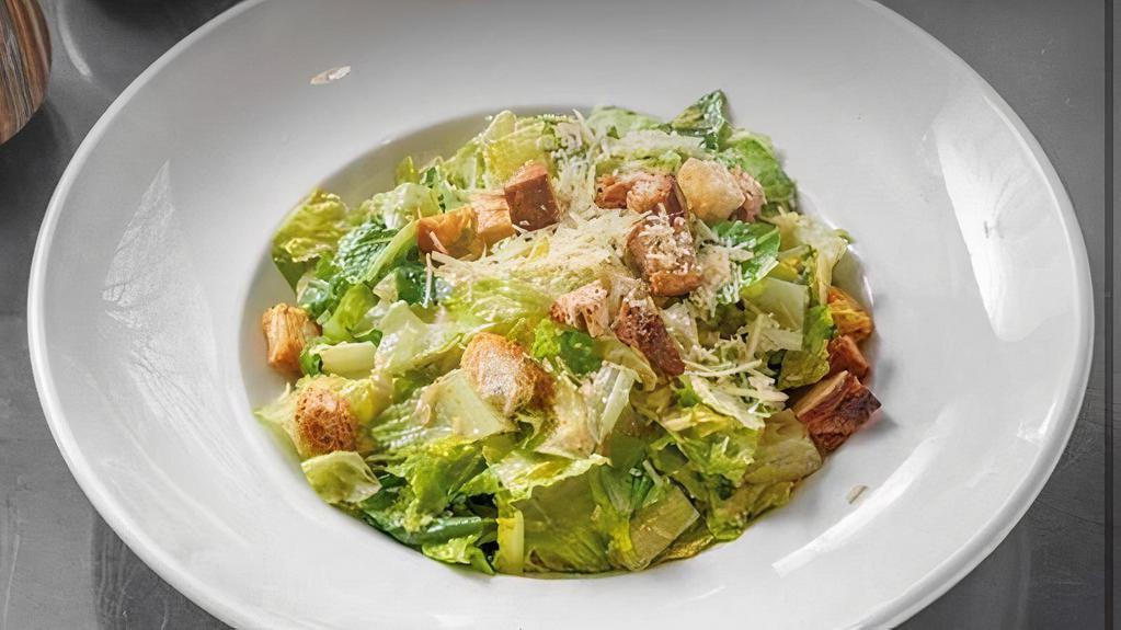 Classic Caesar Salad · Chopped Romaine hearts, grated parmesan, and house made croutons tossed in Caesar dressing