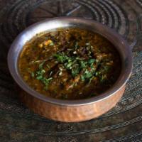 Saag Paneer · Cubes of homemade cheese and a spinach based mouth-watering sauce. Comes with a side of rice